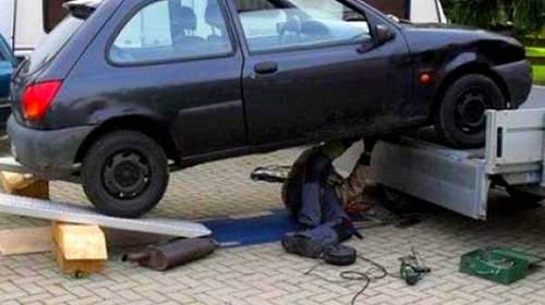 man-unsafe-under-car.jpg