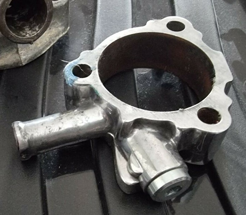 Water temp sender fitting on spacer.jpg