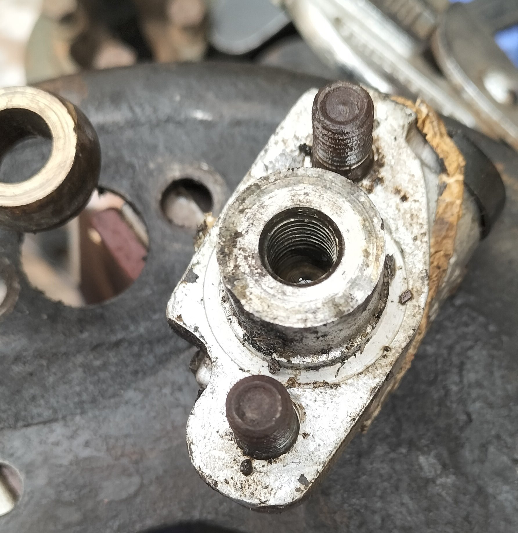A couple of taps with a hammer and the cylinder is out.jpg