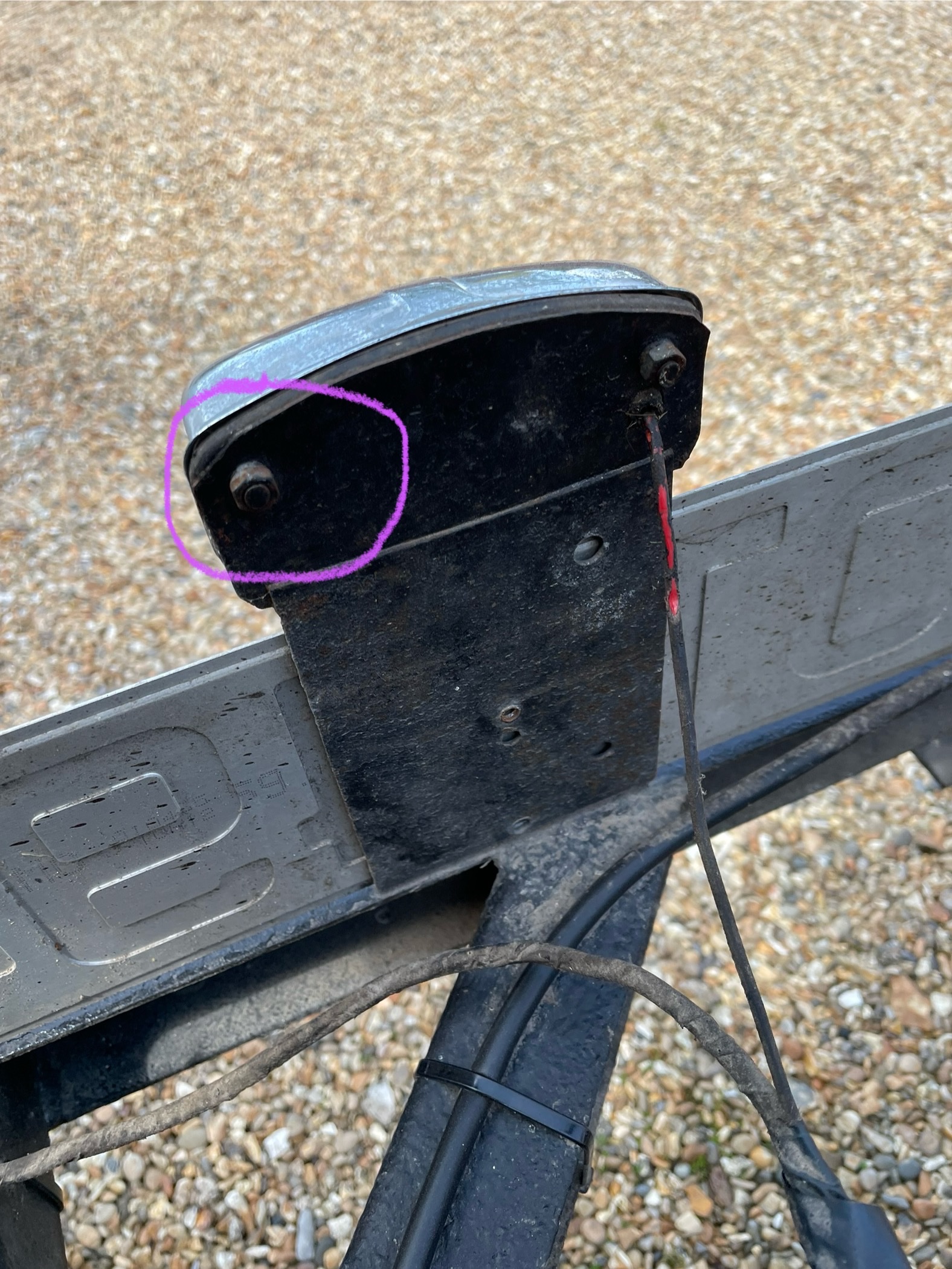 Number plate lamp fixings