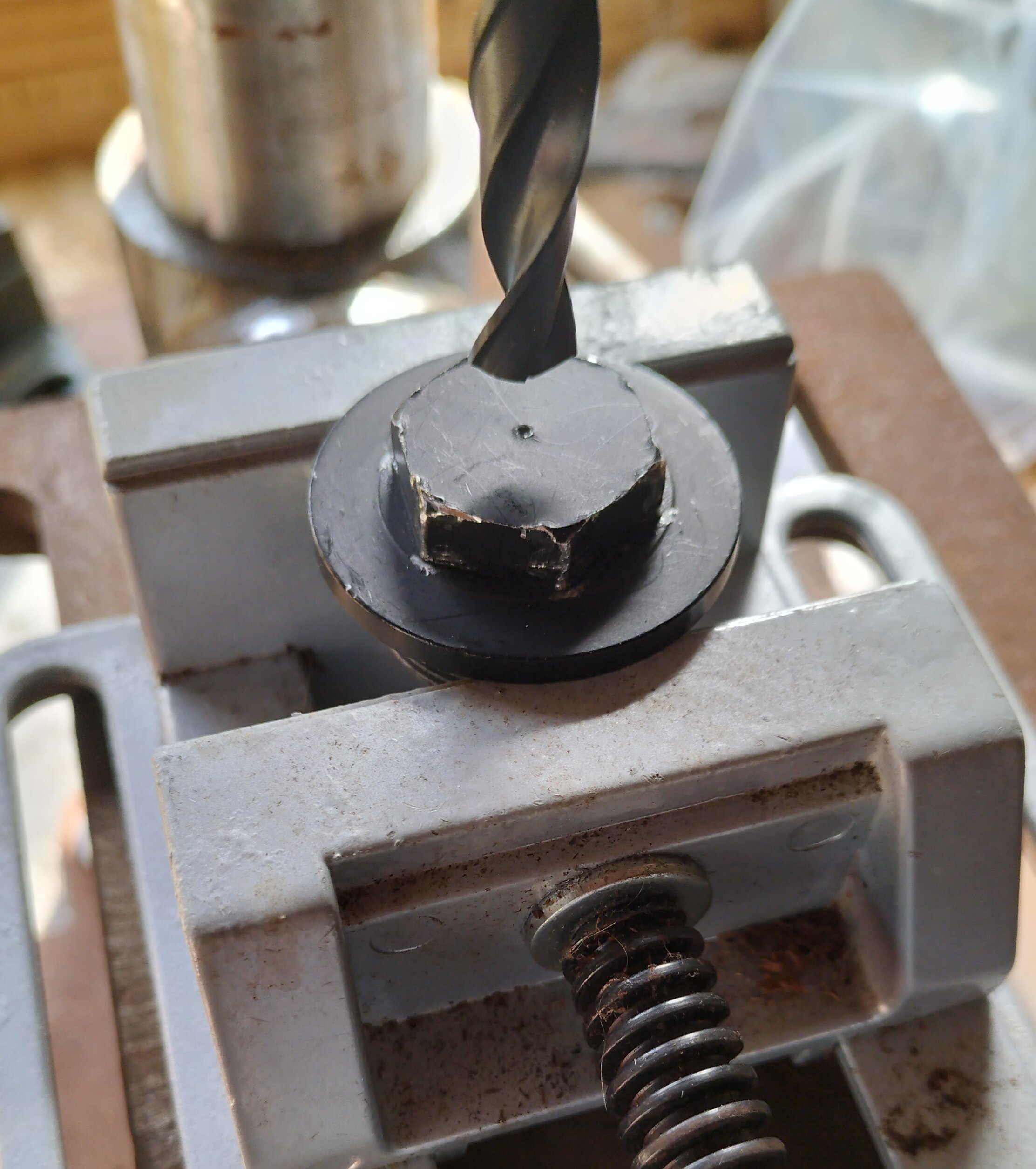 Cap centre-punched and being placed in position.jpg