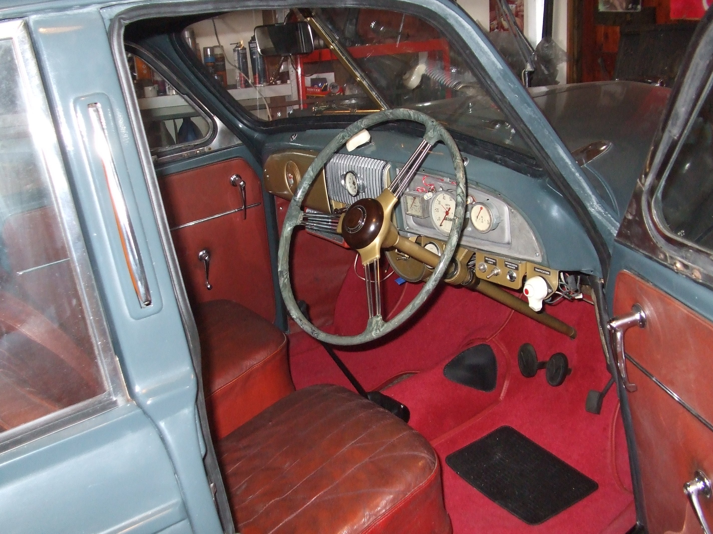 Sally in new paint being reassembled - refurbished steering wheel back in place for the first time in 8 years!.JPG