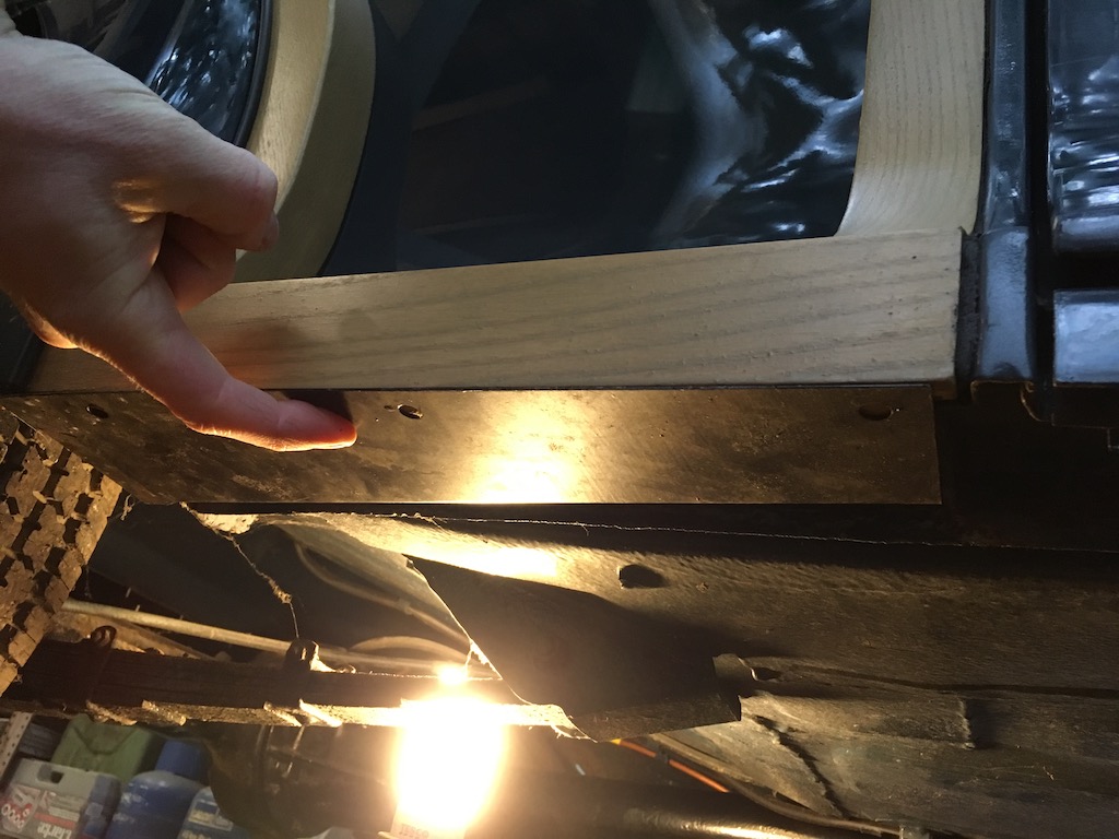 With panel covering bottom of wood